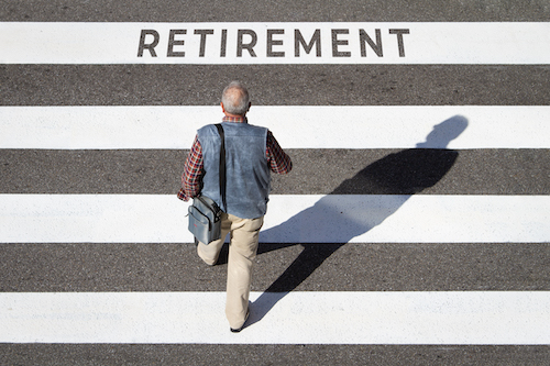 Retirement concept. Scene of a senior man walking in a cebra crossing towards retirement text. Top view